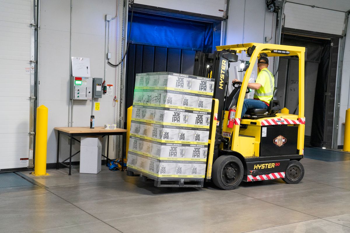 Forklift operator moving stock